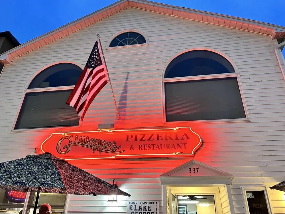 Giuseppe's neon sign glowing at dusk