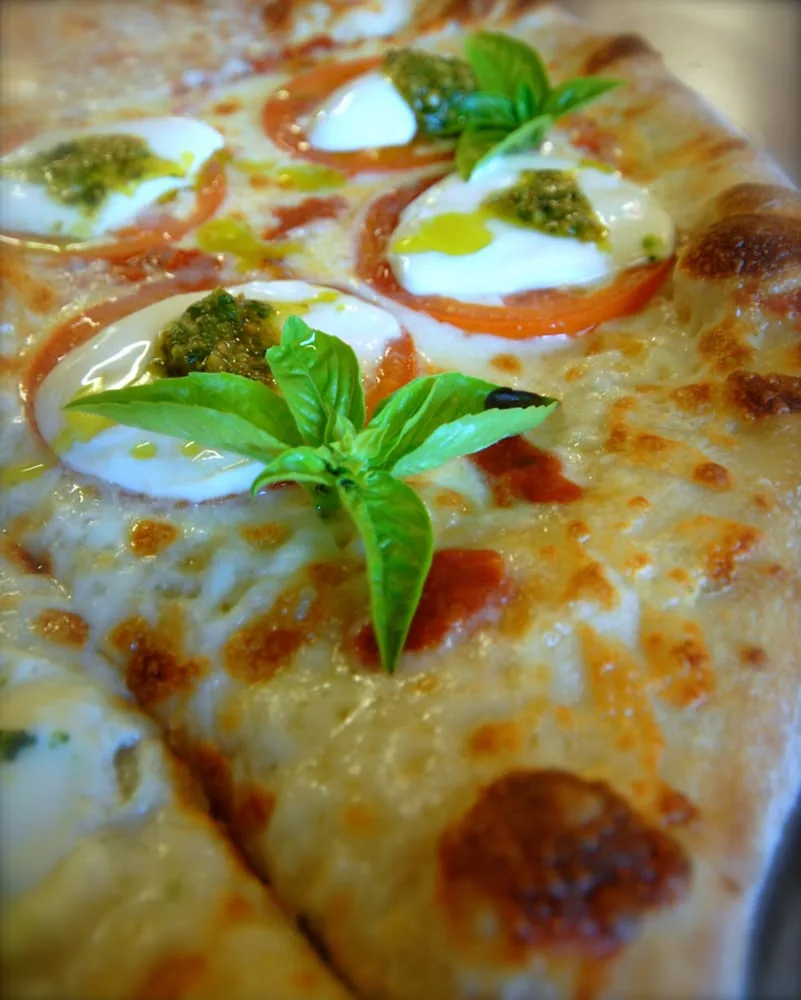 Close-up of a caprese-style pizza
